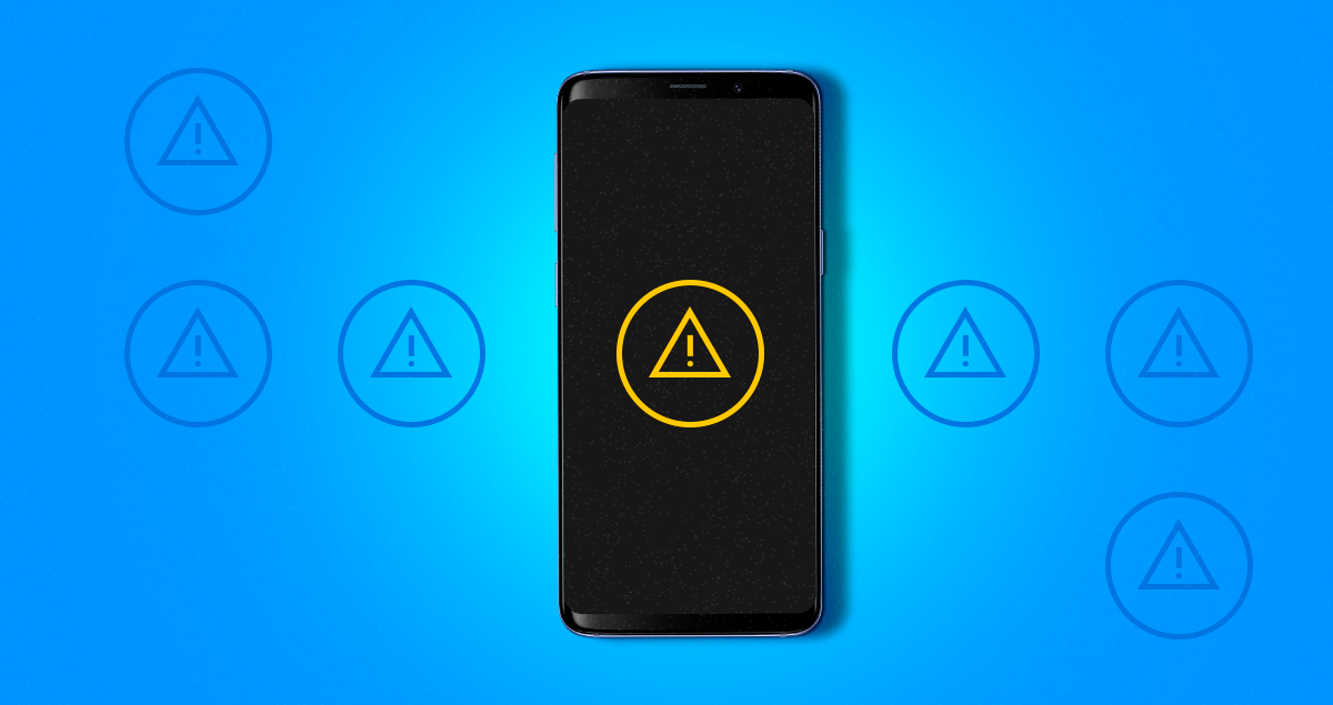 Crimes cibernéticos: exemplos, o que diz a lei e como prevenir 1 Celular com símbolo de alerta na tela do aparelho