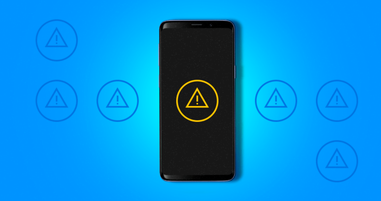 Símbolo de alerta em tela de celular
